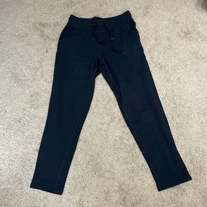 Champion cotton poly track pants with front pockets and drawstring tie. Size S